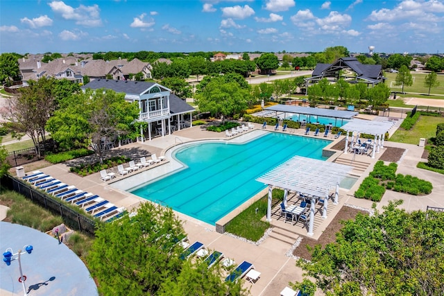 pool featuring fence, a patio area, and a pergola