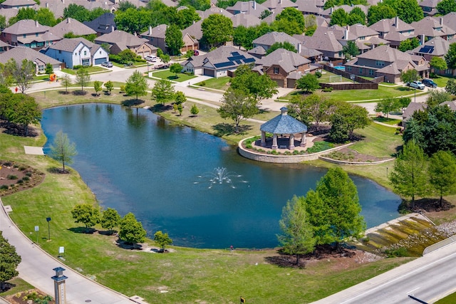 birds eye view of property featuring a water view and a residential view