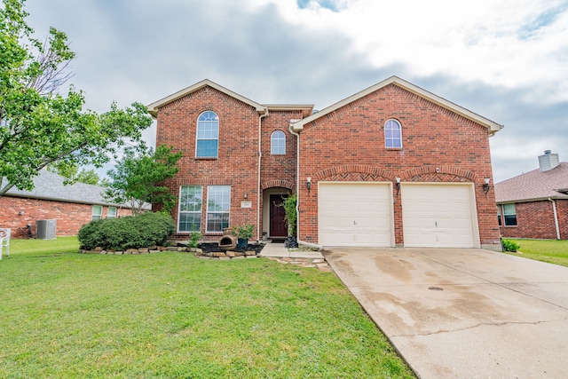 traditional home with a garage, brick siding, driveway, and a front yard