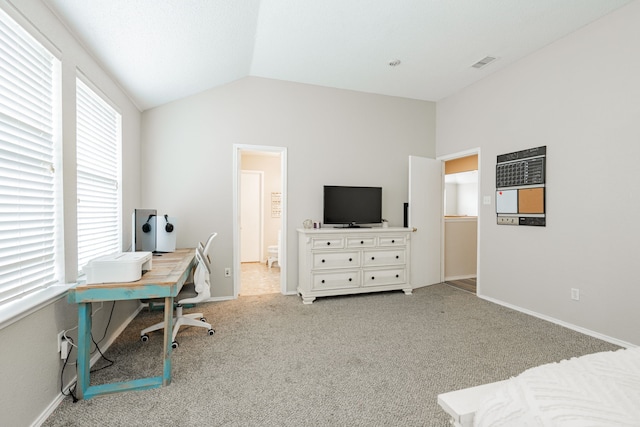 office area featuring baseboards, visible vents, carpet, and vaulted ceiling