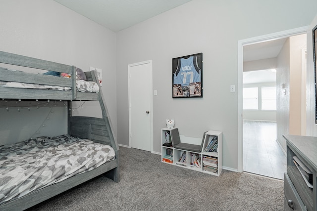 bedroom with carpet and baseboards