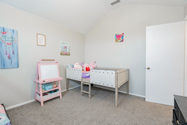 carpeted bedroom featuring baseboards, visible vents, and vaulted ceiling