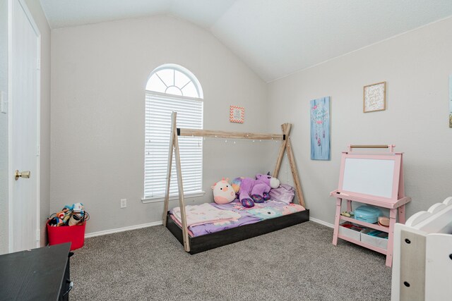 bedroom with baseboards, vaulted ceiling, and carpet floors