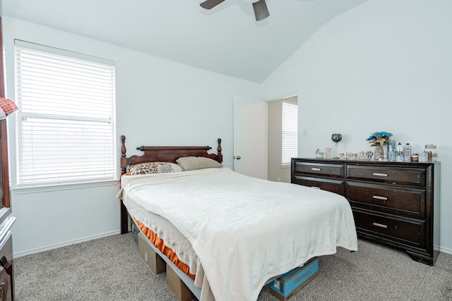 bedroom with light colored carpet, a ceiling fan, lofted ceiling, and baseboards