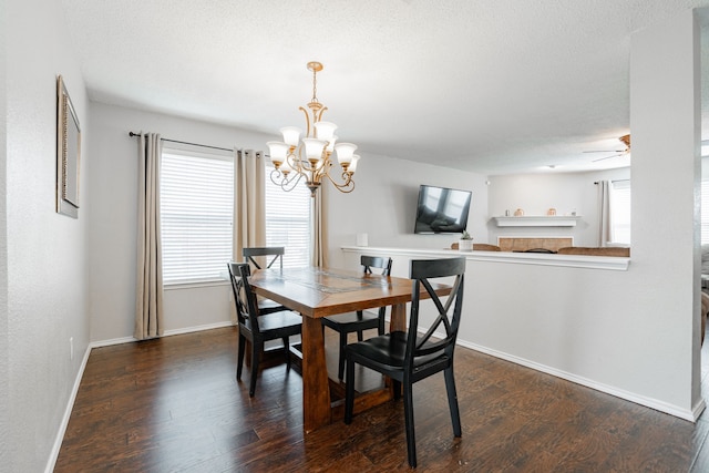 dining space with baseboards, a healthy amount of sunlight, and dark wood-style flooring