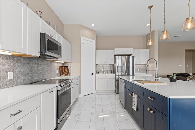 kitchen with a sink, stainless steel appliances, marble finish floor, light countertops, and white cabinets