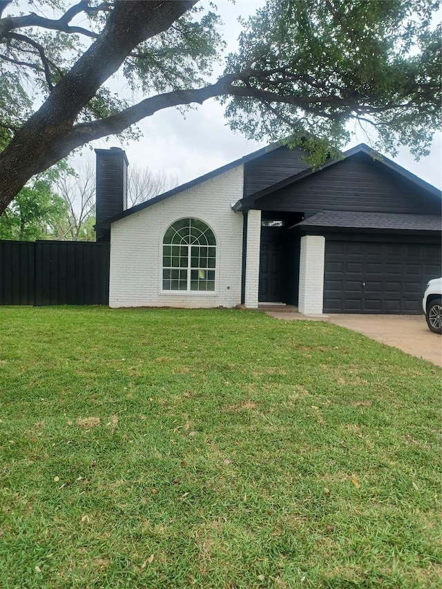 single story home with a chimney, brick siding, fence, a garage, and a front yard