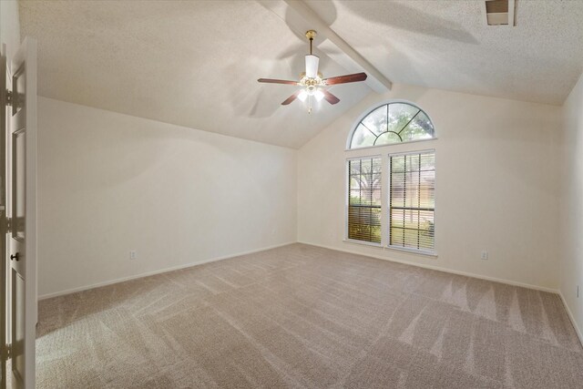 spare room with visible vents, a textured ceiling, carpet floors, and ceiling fan