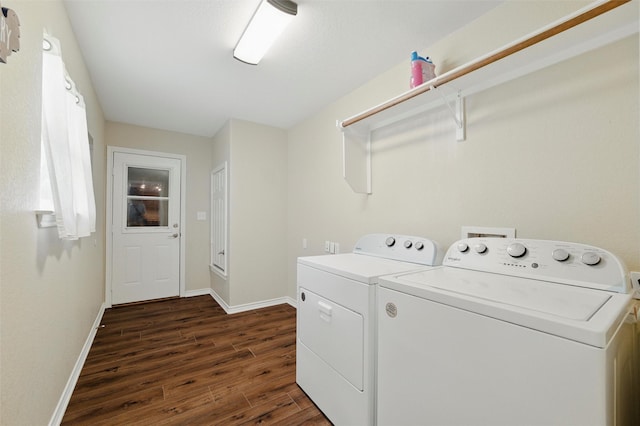laundry room with washing machine and dryer, dark wood-style flooring, laundry area, and baseboards