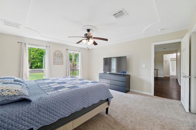 bedroom featuring a ceiling fan, visible vents, carpet, and baseboards