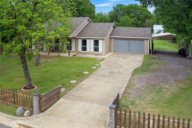 single story home featuring a fenced front yard, roof with shingles, a front yard, concrete driveway, and an attached garage