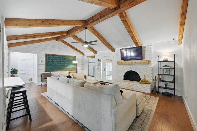 bedroom featuring a ceiling fan, baseboards, visible vents, and wood finished floors