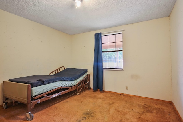 3412 Tin Top Rd, Weatherford, TX 76087 - bedroom featuring carpet floors, a textured ceiling, and baseboards