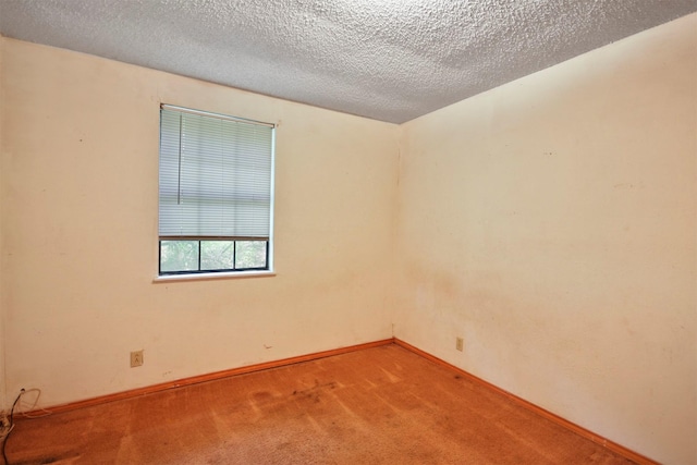 3412 Tin Top Rd, Weatherford, TX 76087 - carpeted spare room with baseboards and a textured ceiling
