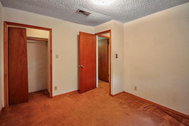 3412 Tin Top Rd, Weatherford, TX 76087 - unfurnished bedroom featuring carpet flooring, a textured ceiling, a closet, and baseboards