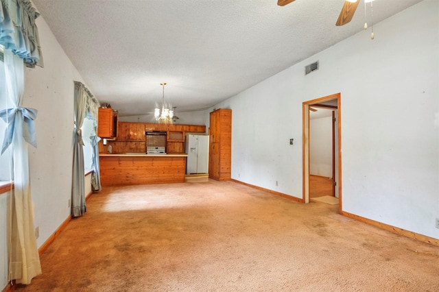 3412 Tin Top Rd, Weatherford, TX 76087 - unfurnished living room with light carpet, a chandelier, lofted ceiling, ceiling fan, and baseboards