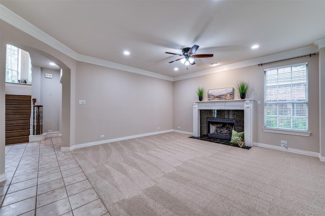 4465 Mira Vista Dr, Frisco, TX 75034 - unfurnished living room with a ceiling fan, recessed lighting, a tile fireplace, stairs, and crown molding