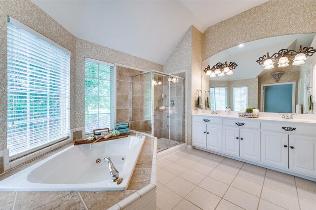 4465 Mira Vista Dr, Frisco, TX 75034 - bathroom with vaulted ceiling, a stall shower, double vanity, a whirlpool tub, and tile patterned flooring