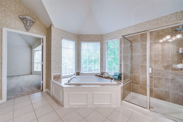 4465 Mira Vista Dr, Frisco, TX 75034 - bathroom with lofted ceiling, a bath, a stall shower, and tile patterned flooring