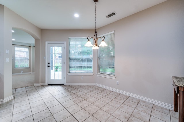4465 Mira Vista Dr, Frisco, TX 75034 - unfurnished dining area with light tile patterned flooring, arched walkways, a chandelier, baseboards, and recessed lighting