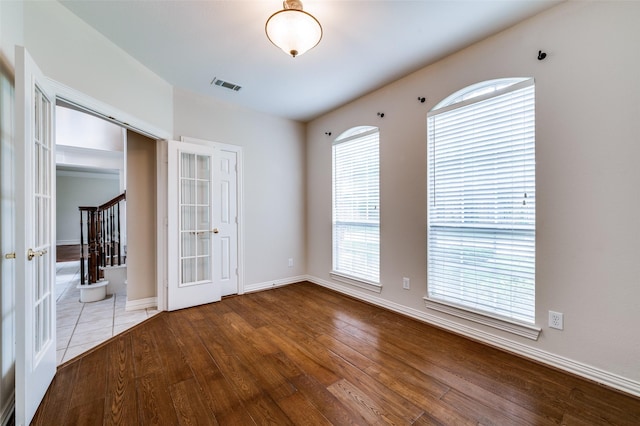 4465 Mira Vista Dr, Frisco, TX 75034 - unfurnished room with french doors, wood finished floors, and plenty of natural light