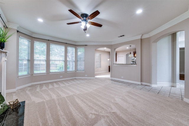 4465 Mira Vista Dr, Frisco, TX 75034 - unfurnished living room with arched walkways, light colored carpet, a ceiling fan, ornamental molding, and recessed lighting