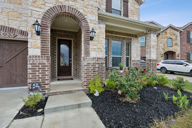 2004 Creekbluff Cir, Lewisville, TX 75010 - view of exterior entry with stone siding and brick siding