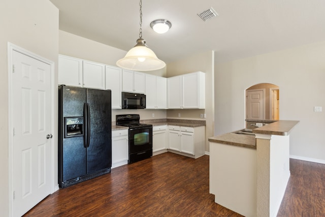 kitchen with black appliances, visible vents, white cabinetry, arched walkways, and dark wood finished floors
