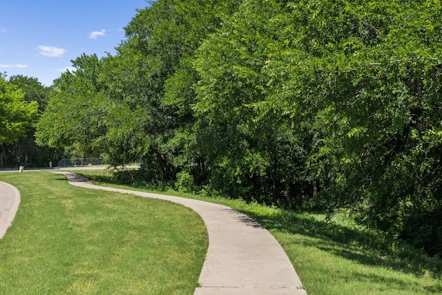 view of home's community with a lawn