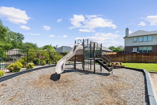 communal playground featuring fence