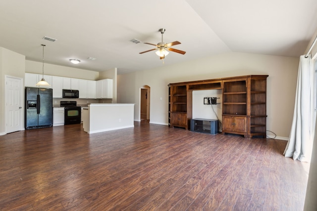 unfurnished living room with arched walkways, ceiling fan, dark wood-style flooring, visible vents, and lofted ceiling