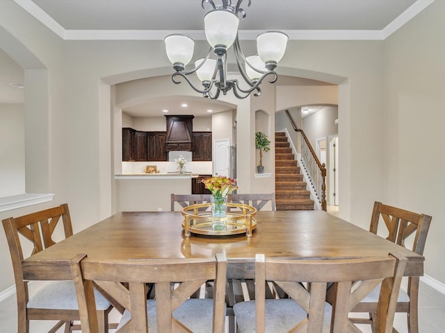 dining space with arched walkways, ornamental molding, stairs, and a chandelier