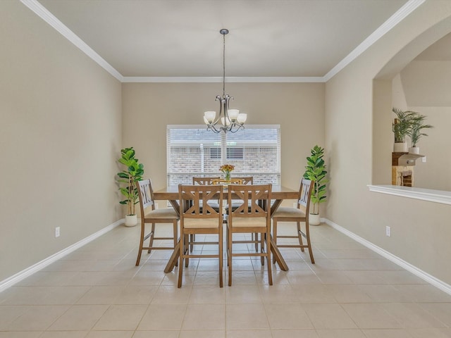 dining room with ornamental molding, a notable chandelier, light tile patterned flooring, and arched walkways