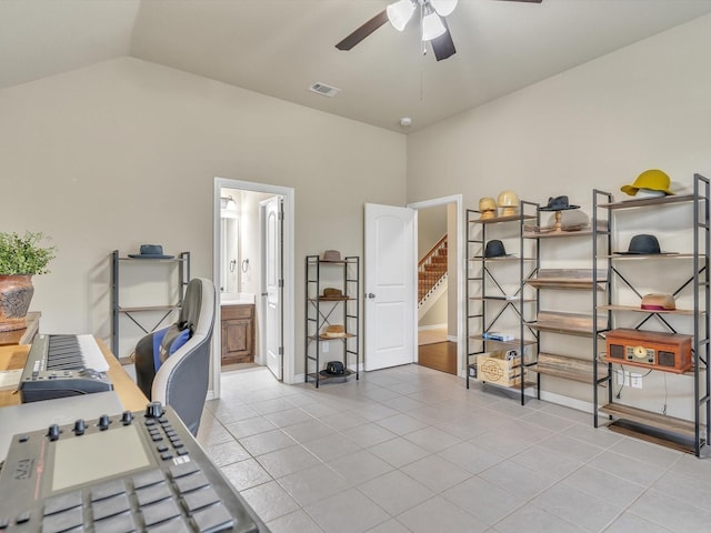 office featuring tile patterned flooring, ceiling fan, lofted ceiling, and visible vents