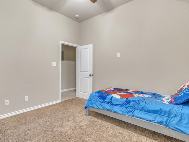 carpeted bedroom featuring a ceiling fan and baseboards