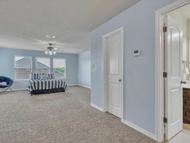 bedroom featuring baseboards, ceiling fan, light carpet, and visible vents