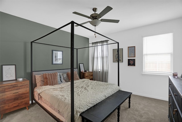 bedroom featuring carpet floors, baseboards, and ceiling fan