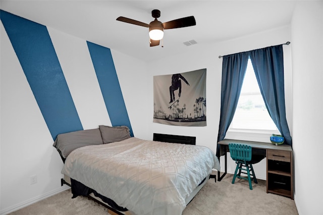 bedroom featuring baseboards, carpet, a ceiling fan, and visible vents