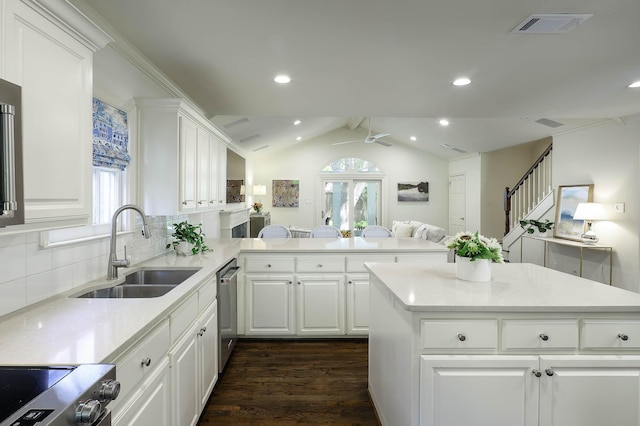 4108 Greenbrier Dr, University Park, TX 75225 - kitchen featuring appliances with stainless steel finishes, vaulted ceiling, a sink, visible vents, and dark wood-type flooring