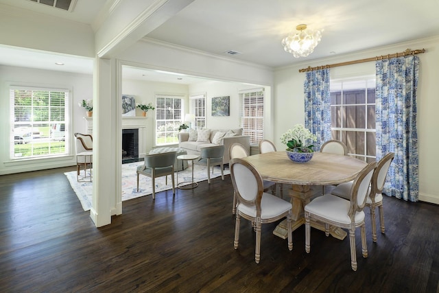 4108 Greenbrier Dr, University Park, TX 75225 - dining area with visible vents, ornamental molding, dark wood finished floors, a fireplace, and a notable chandelier