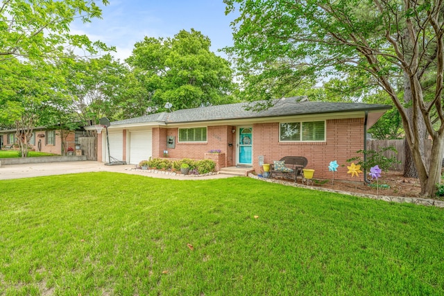 ranch-style home featuring a front lawn, fence, brick siding, an attached garage, and driveway