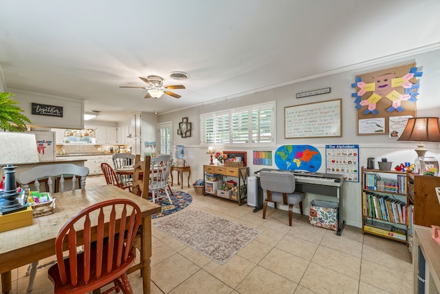 dining area featuring visible vents, ornamental molding, a ceiling fan, and light tile patterned floors