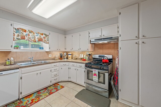 kitchen featuring stainless steel gas range, a sink, dishwasher, white cabinetry, and under cabinet range hood