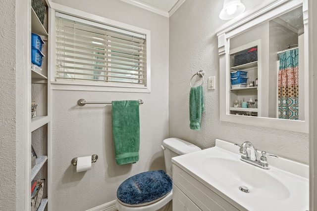 bathroom with crown molding, a textured wall, and toilet