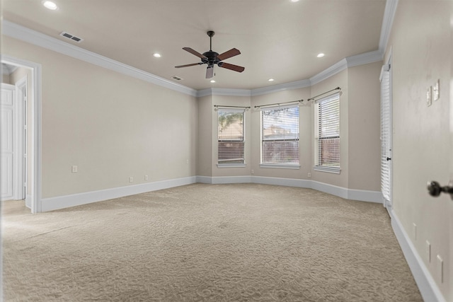 empty room with a ceiling fan, baseboards, light colored carpet, and ornamental molding