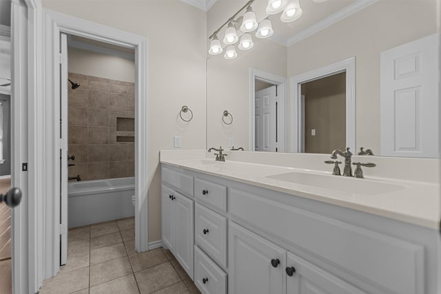 bathroom with double vanity, a sink, tile patterned floors, toilet, and ornamental molding