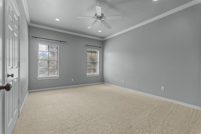 carpeted empty room with crown molding, recessed lighting, baseboards, and a ceiling fan