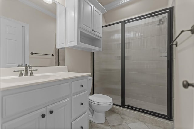 bathroom featuring crown molding, a shower stall, tile patterned floors, vanity, and toilet