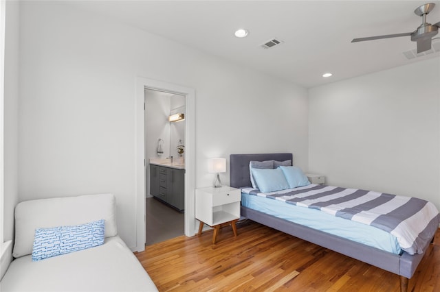 bedroom featuring recessed lighting, ensuite bath, ceiling fan, light wood finished floors, and visible vents