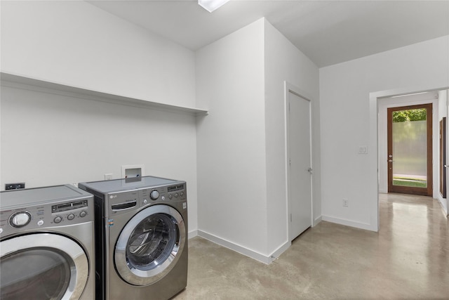 laundry room featuring baseboards, laundry area, and independent washer and dryer